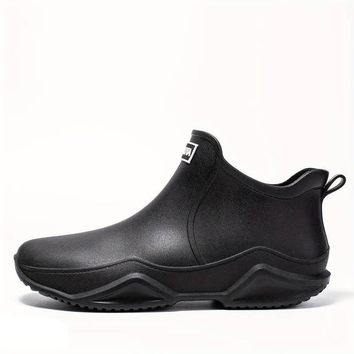 Elegante schwarze orthopädische Gummistiefel für Herren, wasserdicht, ergonomisch, ideal für Komfort und Outdoor-Aktivitäten.
