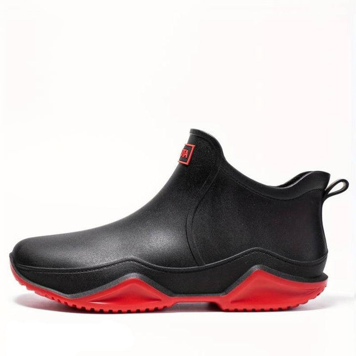 Elegante schwarze orthopädische Gummistiefel für Herren, wasserdicht, ergonomisch, ideal für Komfort und Outdoor-Aktivitäten.