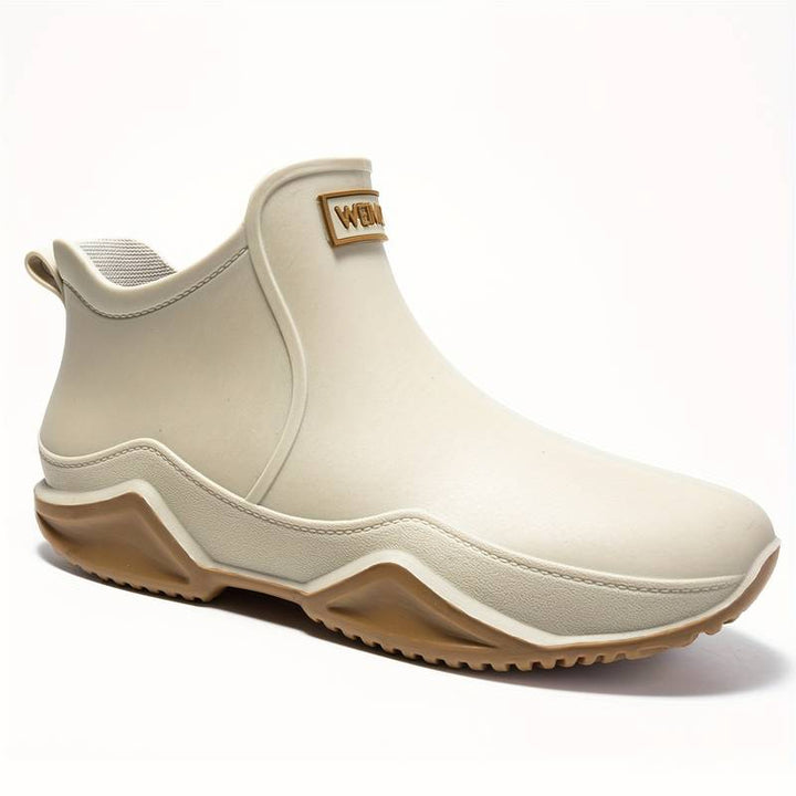 Elegante schwarze orthopädische Gummistiefel für Herren, wasserdicht, ergonomisch, ideal für Komfort und Outdoor-Aktivitäten.