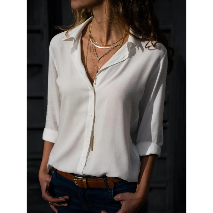 Elegante, weiße Langarmbluse mit vielseitiger Knopfleiste, taillierter Schnitt, ideal für Büro und Abendveranstaltungen.