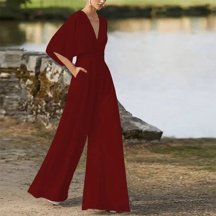 "Eleganter Damen-Jumpsuit mit V-Ausschnitt, Dolman-Ärmeln, elastischem Bund und weiten Hosen in Schwarz und Weinrot."