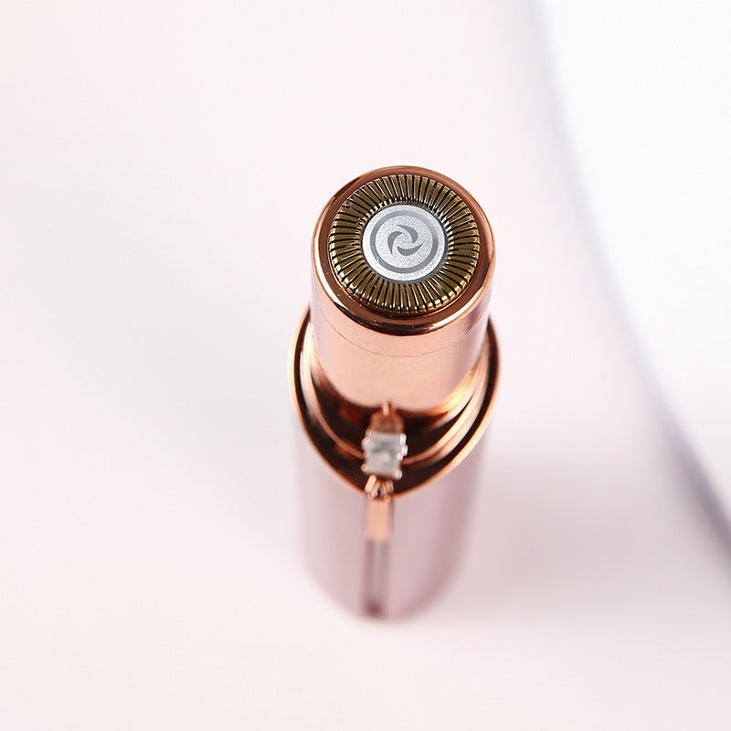 "Eleganter Gesichts-Haarentferner, roségold, kompakt, mit Licht, für schmerzfreie Gesichtshaarentfernung, Beauty-Tool."