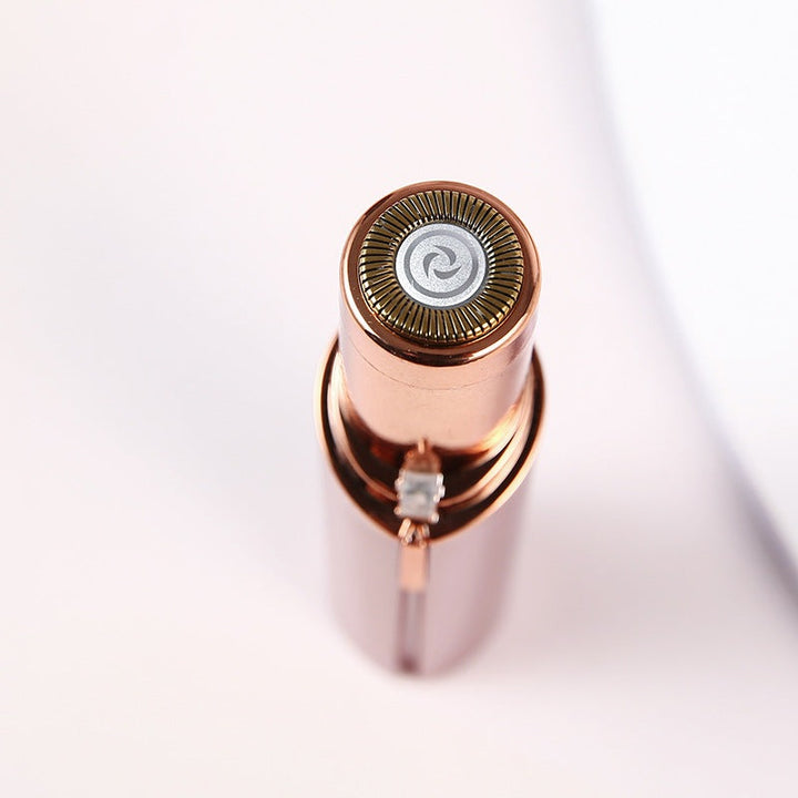 "Eleganter Gesichts-Haarentferner, roségold, kompakt, mit Licht, für schmerzfreie Gesichtshaarentfernung, Beauty-Tool."