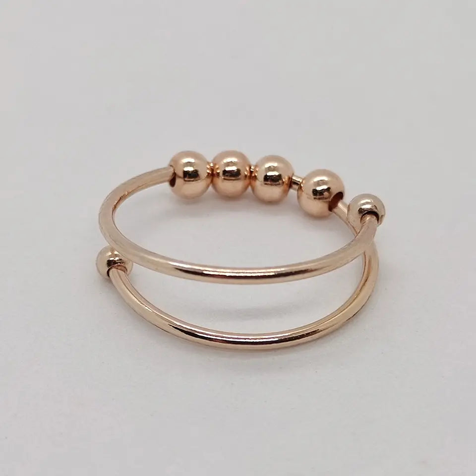 Eleganter verstellbarer Anti-Stress-Ring aus Silber mit Gold oder Roségold, minimalistisch und perfekt zum Stressabbau.