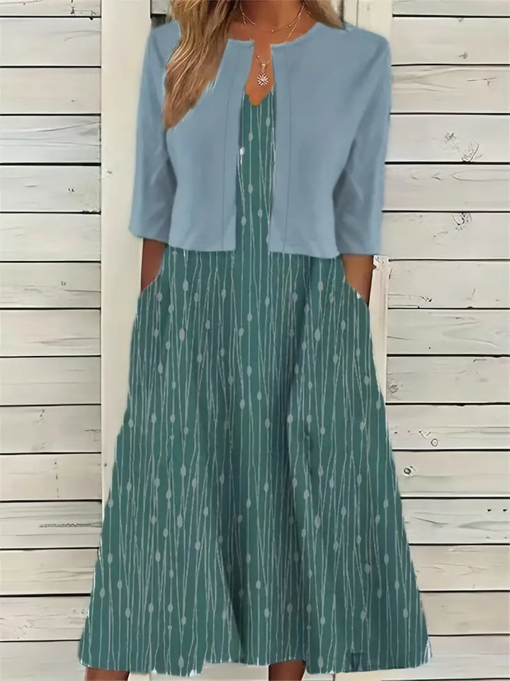 Elegantes Blumen-Set für Frauen: Blumiges Kleid und schlichtes Crop-Top, zweiteiliges Outfit, ideal für besondere Anlässe.