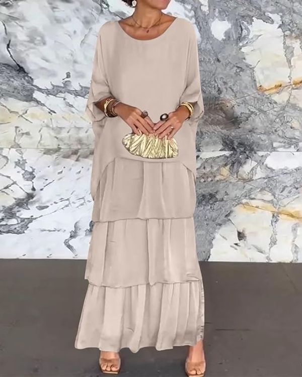 Elegantes Chiffonkleid in Lagenoptik, zeitloses Design, schmeichelhafte Passform, perfekte Auswahl für verschiedene Anlässe.