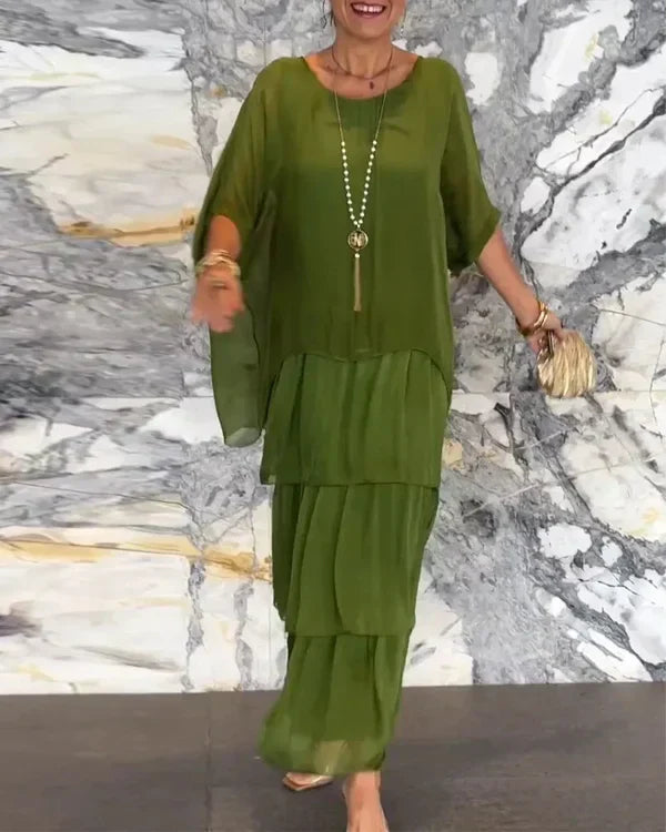 Elegantes Damen Chiffonkleid mit Lagenlook, fließend und figurbetont, ideal für festliche Anlässe und formelle Events.