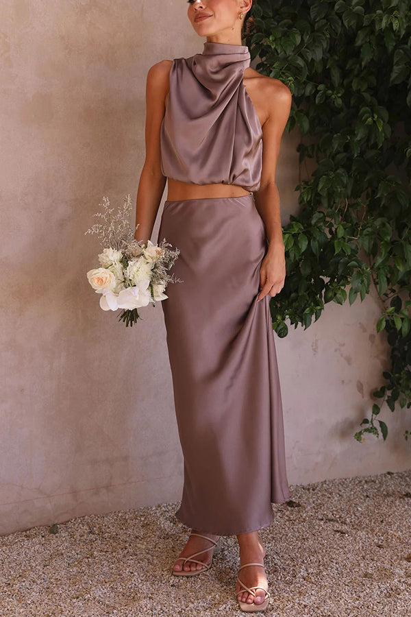 Elegantes Damen Set mit fließendem Maxirock und schickem Top in Cremeweiß für stilvolle Anlässe.