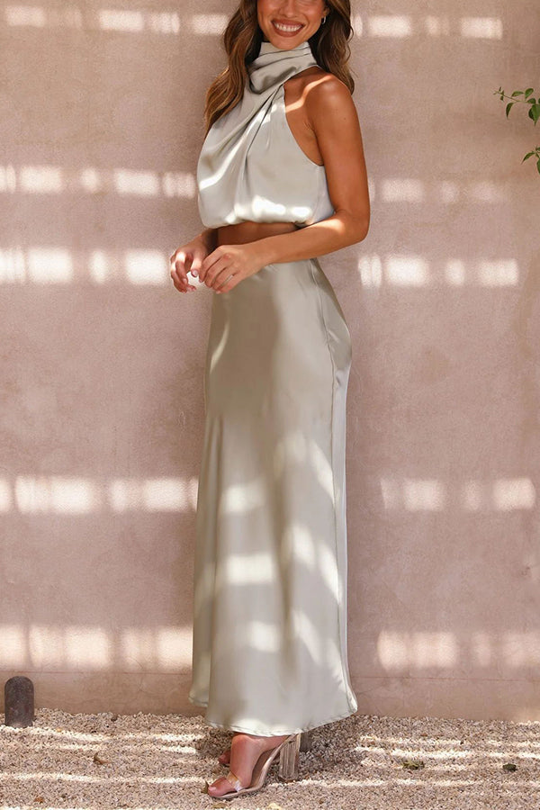 Elegantes Damen Set mit fließendem Maxirock und schickem Top in Cremeweiß für stilvolle Anlässe.