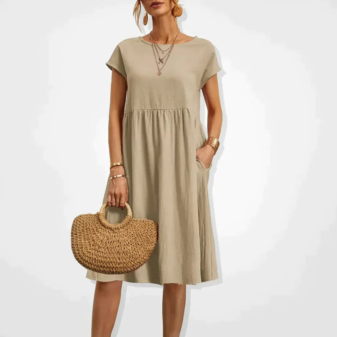 "Elegantes Damen-Sommerkleid mit Empire-Silhouette, kurze Ärmel, luftiger Rock, ideal für warme Tage, vielseitiger Stil."