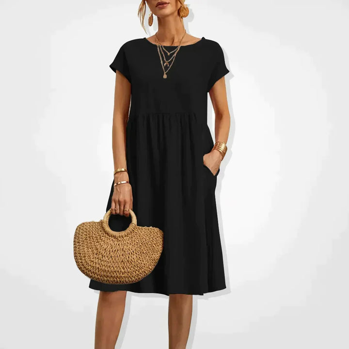 "Elegantes Damen-Sommerkleid mit Empire-Silhouette, kurze Ärmel, luftiger Rock, ideal für warme Tage, vielseitiger Stil."