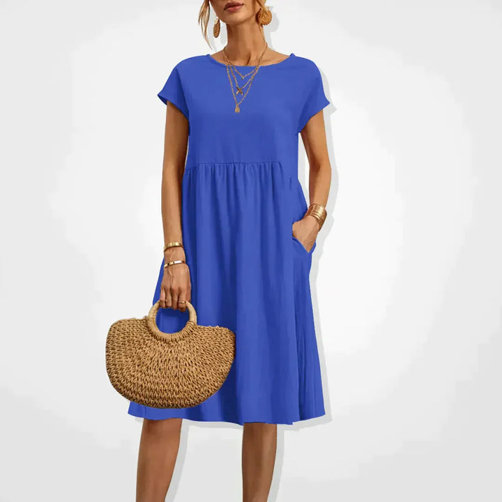 "Elegantes Damen-Sommerkleid mit Empire-Silhouette, kurze Ärmel, luftiger Rock, ideal für warme Tage, vielseitiger Stil."