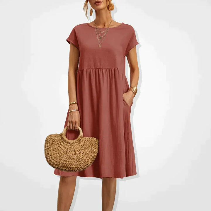"Elegantes Damen-Sommerkleid mit Empire-Silhouette, kurze Ärmel, luftiger Rock, ideal für warme Tage, vielseitiger Stil."