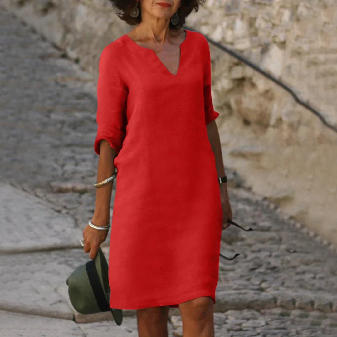 Elegantes Damenkleid mit V-Ausschnitt, 3/4-Ärmeln und knielangem Design, ideal für vielseitige Anlässe, aus leichtem Stoff.