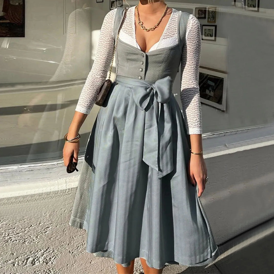 "Elegantes langärmliges Dirndlkleid für Damen, Midi-Länge, mit aufwändiger Stickerei und Schleifenakzent in traditionellem De