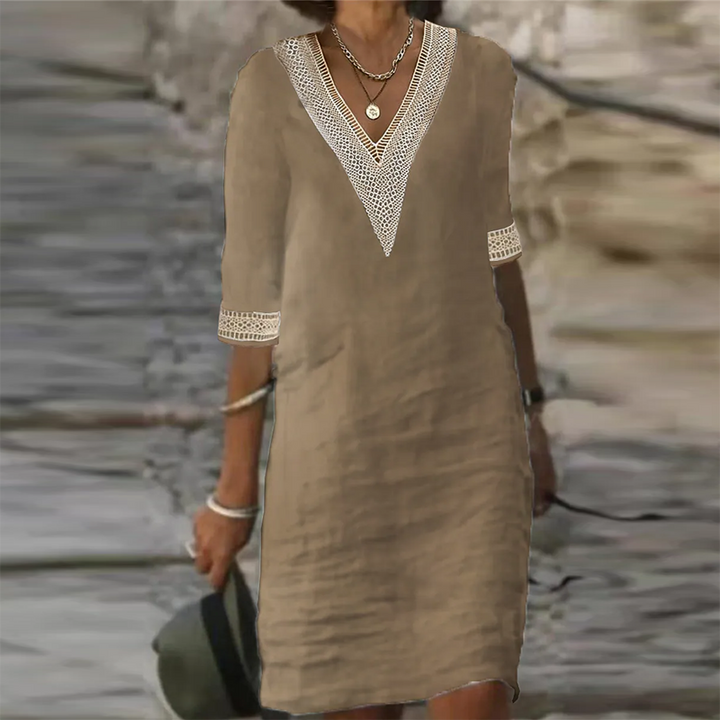 Elegantes Leinen Sommerkleid Damen in Weiß, knielang, mit kurzer Ärmeloptik und leichtem Stoff für elegante Anlässe.