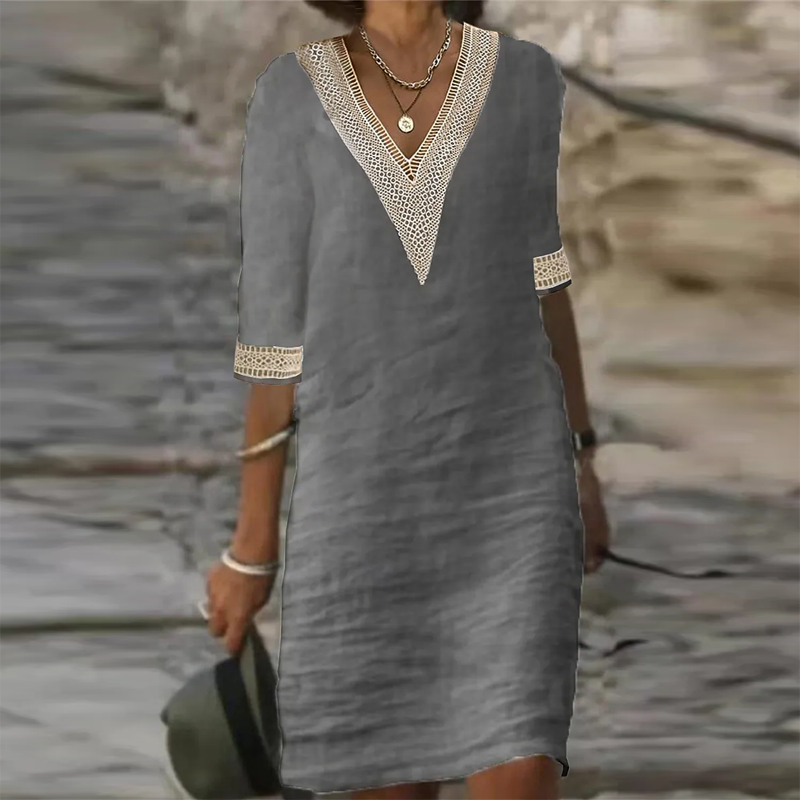 Elegantes Leinen Sommerkleid Damen in Weiß, knielang, mit kurzer Ärmeloptik und leichtem Stoff für elegante Anlässe.