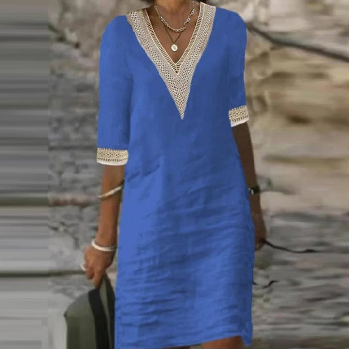 Elegantes Leinen Sommerkleid Damen in Weiß, knielang, mit kurzer Ärmeloptik und leichtem Stoff für elegante Anlässe.