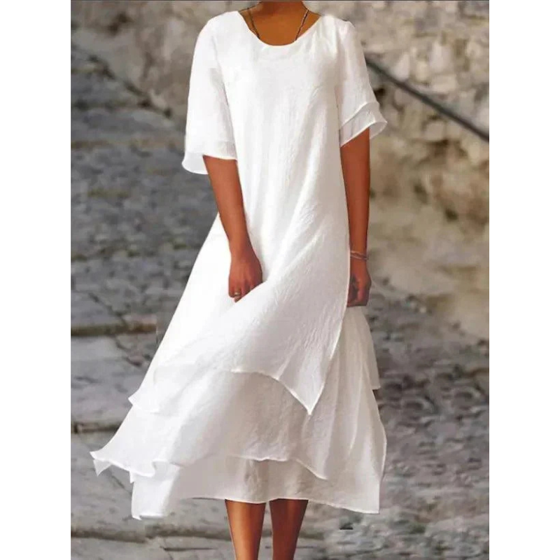 Elegantes Midi Damenkleid mit fließendem Stoff in sanften Farben, umschmeichelt die Figur und bietet hohen Tragekomfort.