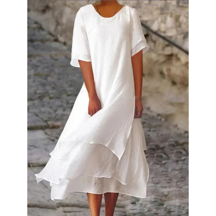 Elegantes Midi Damenkleid mit fließendem Stoff in sanften Farben, umschmeichelt die Figur und bietet hohen Tragekomfort.