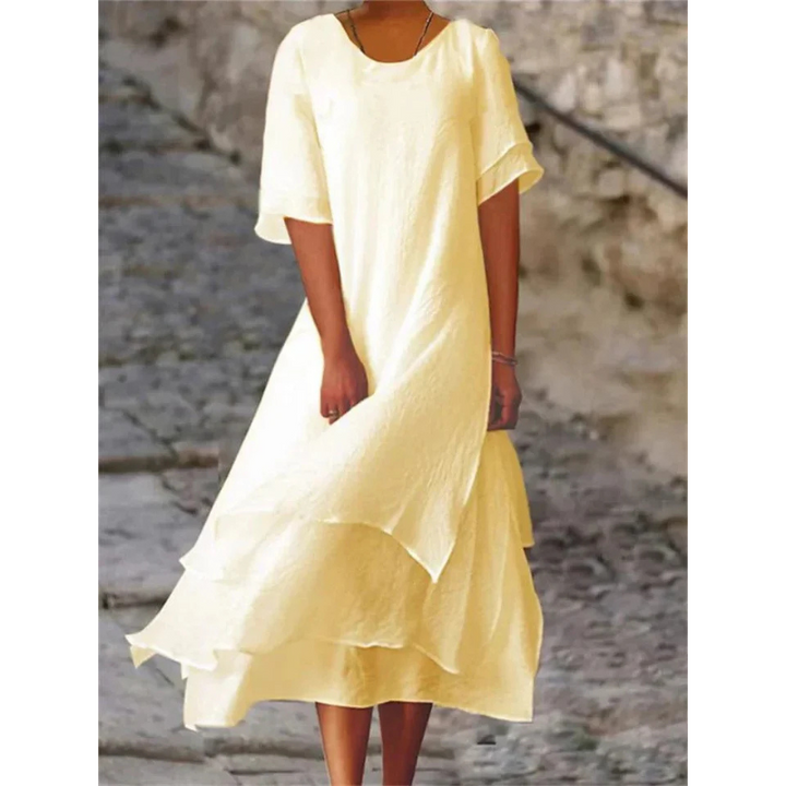 Elegantes Midi Damenkleid mit fließendem Stoff in sanften Farben, umschmeichelt die Figur und bietet hohen Tragekomfort.