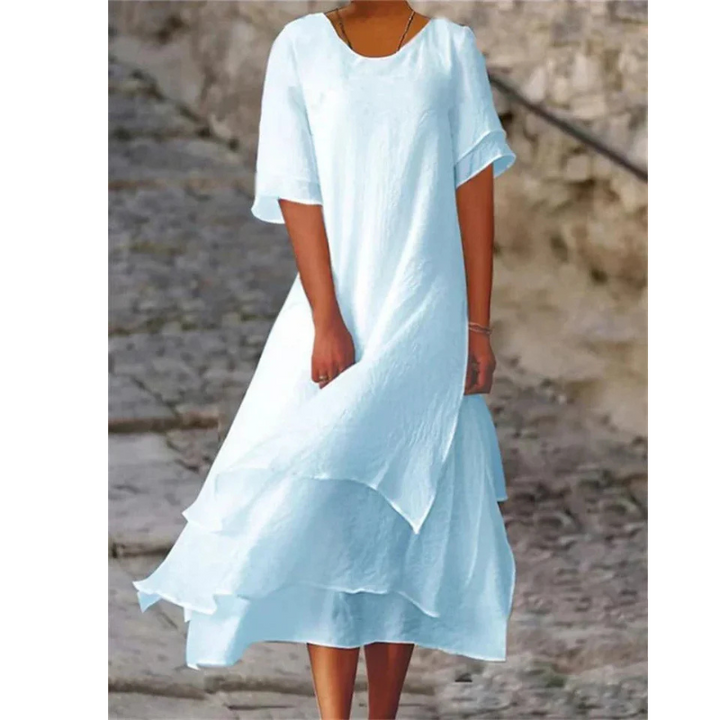 Elegantes Midi Damenkleid mit fließendem Stoff in sanften Farben, umschmeichelt die Figur und bietet hohen Tragekomfort.