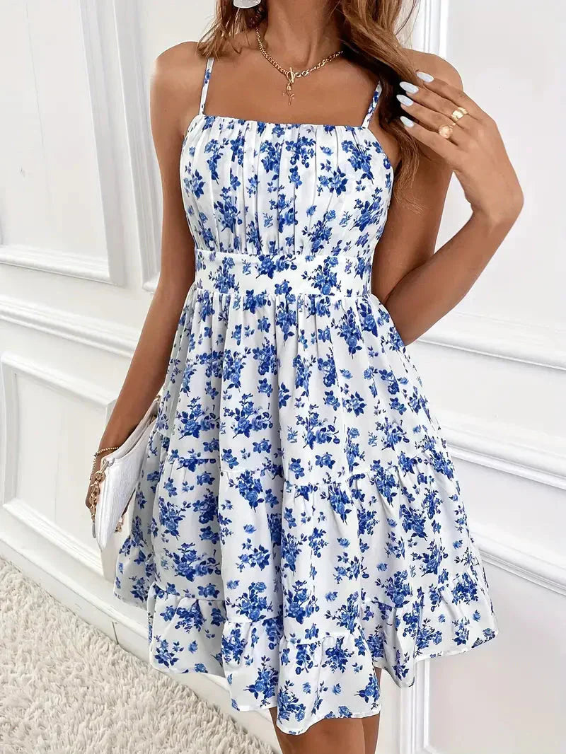 Elegantes Sommerkleid aus Leinen mit Blumendruck und Spaghetti-Trägern, ideal für Damen an sonnigen Tagen.