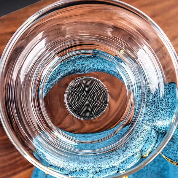 "Elegantes Teeset mit magnetischem System, Glasteekanne, Filter, Tassen; stilvolles Design, ideal für Teeliebhaber."