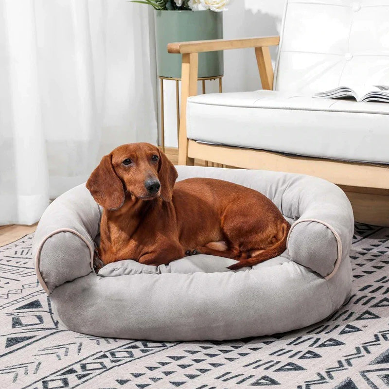 "Graues orthopädisches Hundebett, beruhigendes Design, natürliche Materialien, für maximalen Komfort und Stressabbau."
