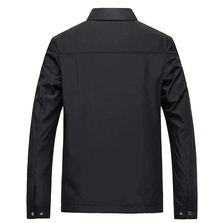 "Herren Frühjahrsjacke in Blau, wasserabweisend mit modernem Stehkragen, für Business und Casual Looks geeignet."