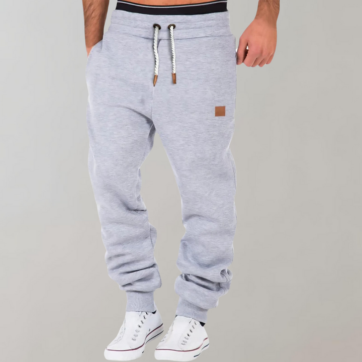 "Herren Jogginghose, bequem & stilvoll, schlankes Design in Grau mit elastischem Bund und Seitentaschen für Herren"