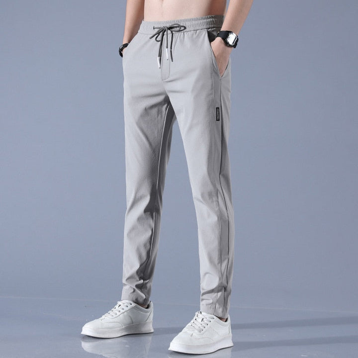 "Herren-Stretchhose, atmungsaktiv, schnelltrocknend, elastisch, vielseitig, grau, moderne Passform, ideal für Sport und Allta
