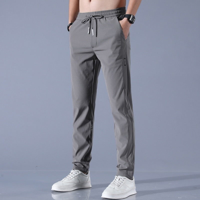 "Herren-Stretchhose, atmungsaktiv, schnelltrocknend, elastisch, vielseitig, grau, moderne Passform, ideal für Sport und Allta