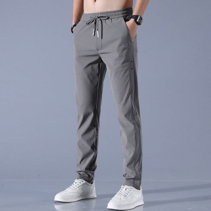 "Herren-Stretchhose, atmungsaktiv, schnelltrocknend, elastisch, vielseitig, grau, moderne Passform, ideal für Sport und Allta