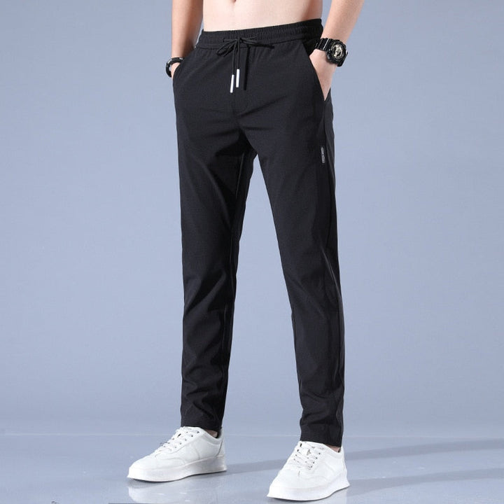 "Herren-Stretchhose, atmungsaktiv, schnelltrocknend, elastisch, vielseitig, grau, moderne Passform, ideal für Sport und Allta