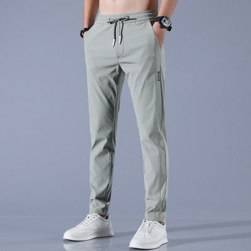 "Herren-Stretchhose, atmungsaktiv, schnelltrocknend, elastisch, vielseitig, grau, moderne Passform, ideal für Sport und Allta