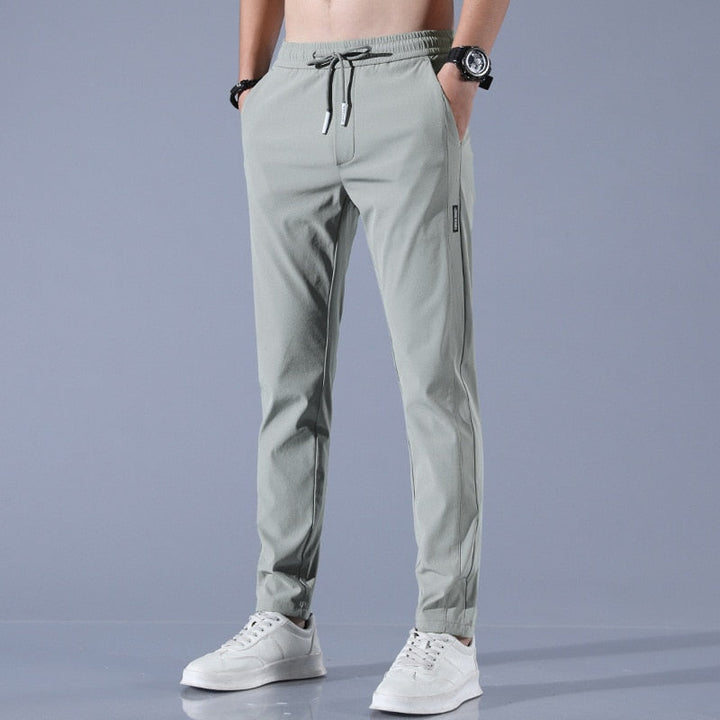 "Herren-Stretchhose, atmungsaktiv, schnelltrocknend, elastisch, vielseitig, grau, moderne Passform, ideal für Sport und Allta