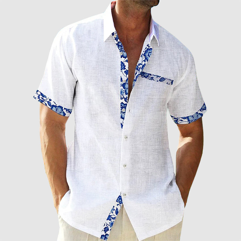 Herrenhemd mit tropischem Muster, kurzes Design, lässig-elegant, ideal für Sommer und Freizeit, angenehmes Tragegefühl.