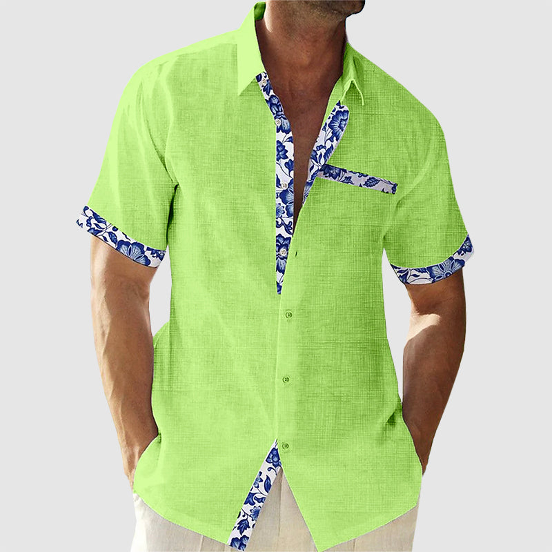 Herrenhemd mit tropischem Muster, kurzes Design, lässig-elegant, ideal für Sommer und Freizeit, angenehmes Tragegefühl.