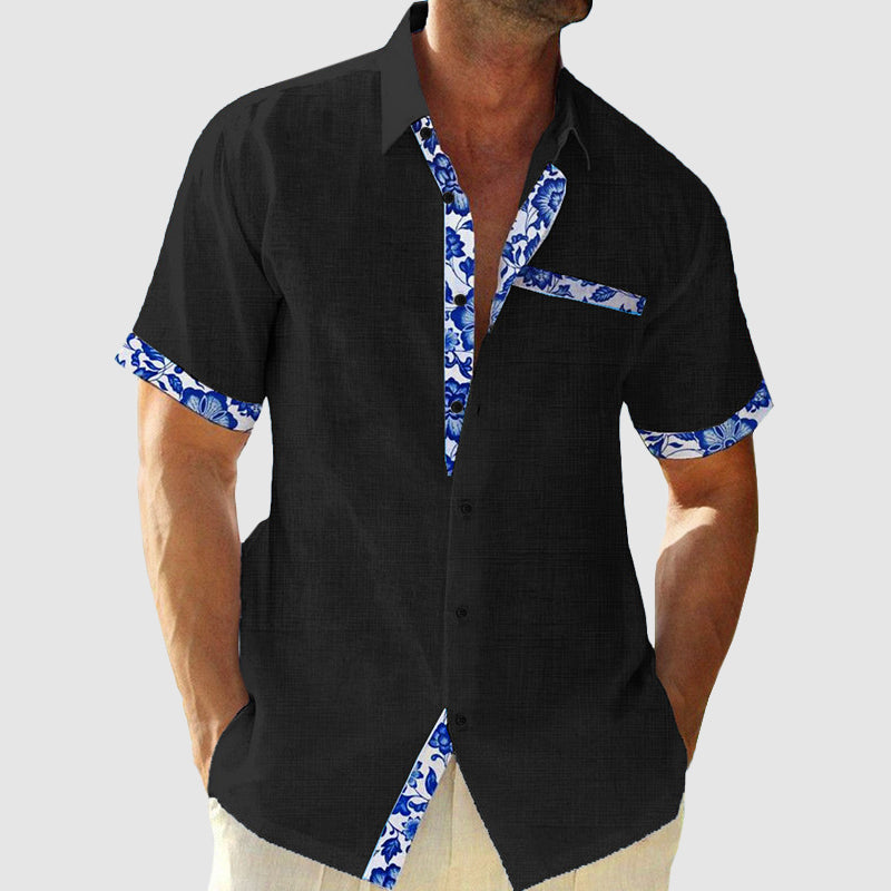 Herrenhemd mit tropischem Muster, kurzes Design, lässig-elegant, ideal für Sommer und Freizeit, angenehmes Tragegefühl.