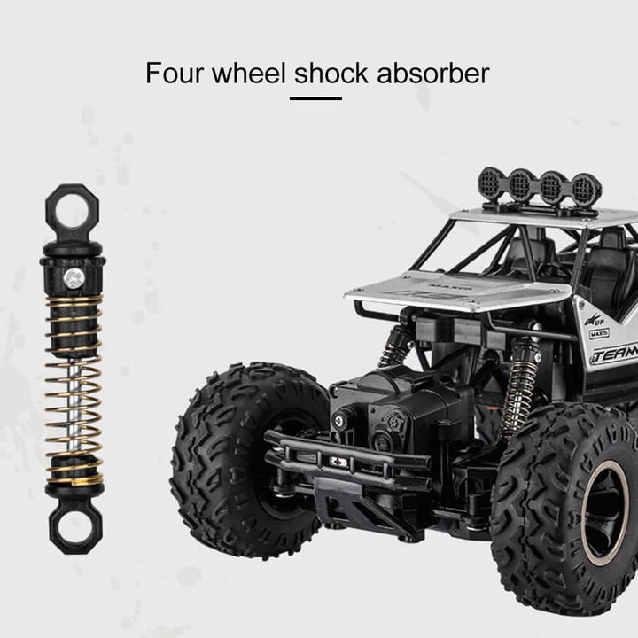 "Imposanter 4x4 RC-Monstertruck in Geländefahrt, robustes Design, geländegängig, ideal für Offroad-Abenteuer."