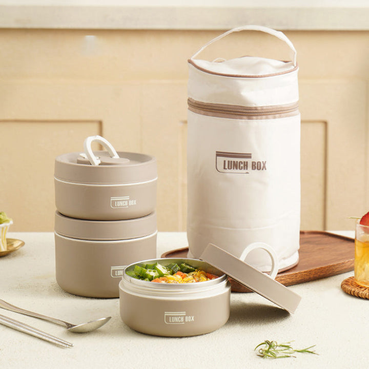 "Isolierte mehrschichtige Lunchbox aus Edelstahl, rund gestapelt und vorne abgebildet, ideal für warme Speisen unterwegs."