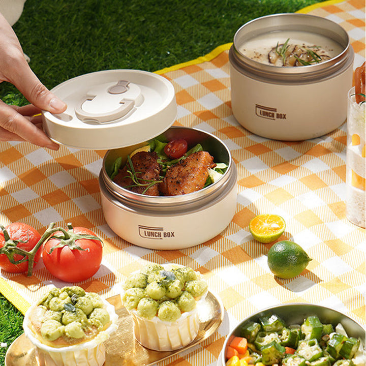 "Isolierte mehrschichtige Lunchbox aus Edelstahl, rund gestapelt und vorne abgebildet, ideal für warme Speisen unterwegs."