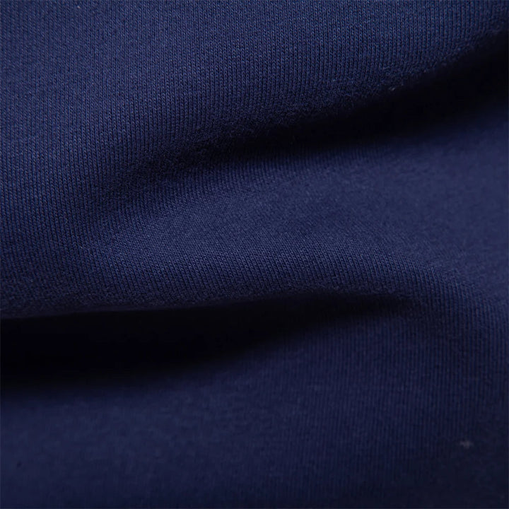 "Klassisches Rugby-Poloshirt für Herren, marineblau mit weißem Kragen, aus Baumwollmischung, sportlich-elegant."