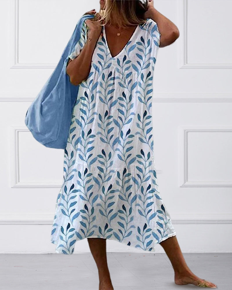 "Kleid mit V-Ausschnitt und Blätterdruck, schmeichelnde Passform, lebhafte Anmutung, Damenmode, elegant und natürlich."