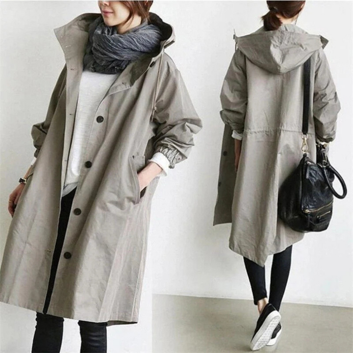 "Langer, eleganter Damen-Trenchcoat, wasserdicht, mit stilvoller Passform in Beige. Ideal für Wintermode und schlechte Wetter