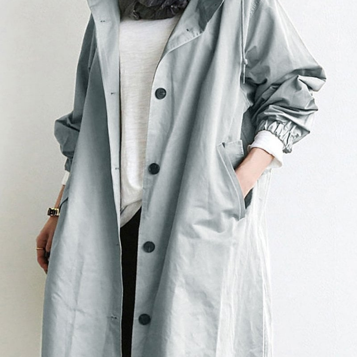 "Langer, eleganter Damen-Trenchcoat, wasserdicht, mit stilvoller Passform in Beige. Ideal für Wintermode und schlechte Wetter