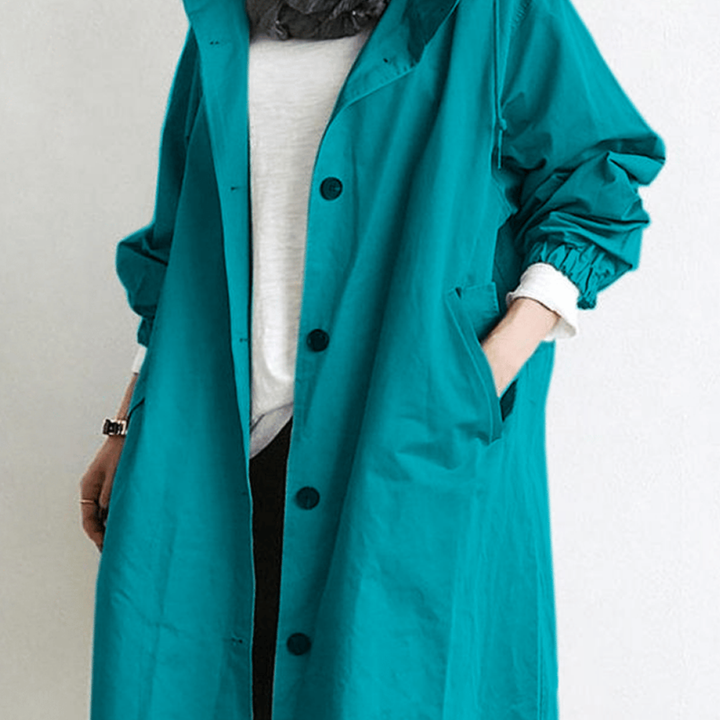 "Langer, eleganter Damen-Trenchcoat, wasserdicht, mit stilvoller Passform in Beige. Ideal für Wintermode und schlechte Wetter