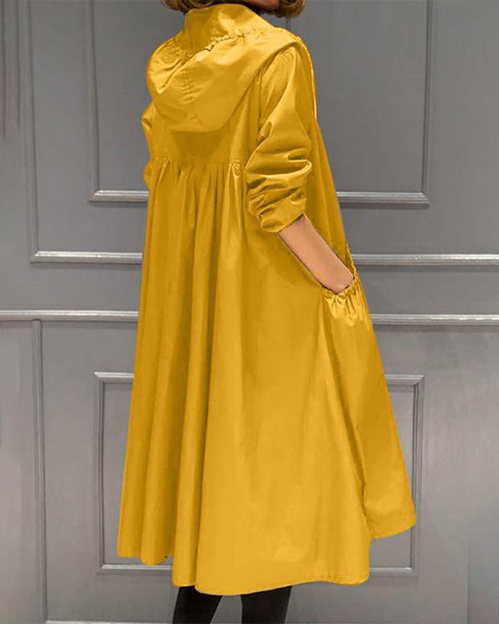 Langer, wasserfester Damen-Trenchcoat mit Kapuze, unifarben, ideal für Herbst/Winter, elegant und funktional.