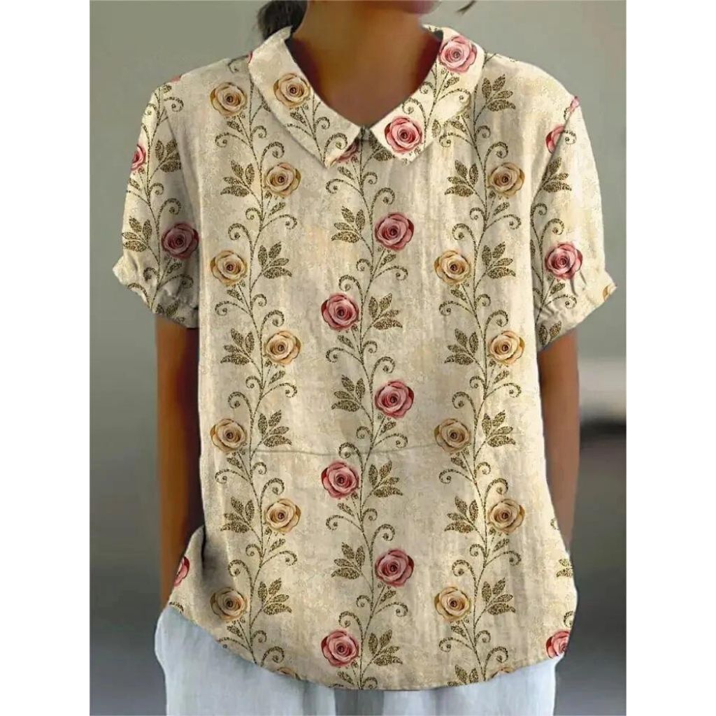 Lässige Damenbluse mit floralem Print, aus leichter Baumwolle, Rundhals und kurzen Ärmeln für sommerliche Tage.
